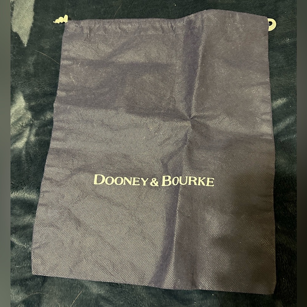 Dooney & Bourke navy blue dust cover.  Never used.  Excellent condition.